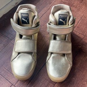 Gold puma high top sneakers